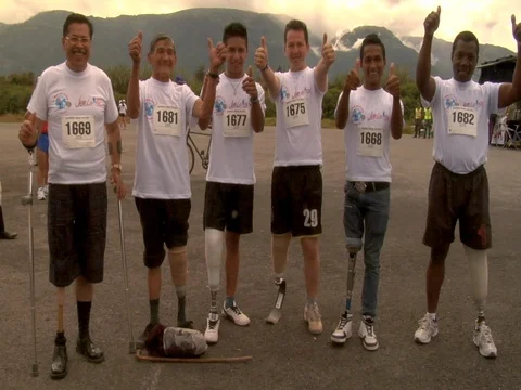 Six disabled handicapped men with prosthetic legs smiling for the camera Stock Footage 90361614