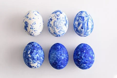 Six Easter eggs in the color of the year-classic blue with gradient effect in Stock Photos