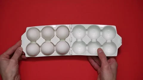 Six eggs in container, which opens and closes. Egg consumption 動画素材 297398136