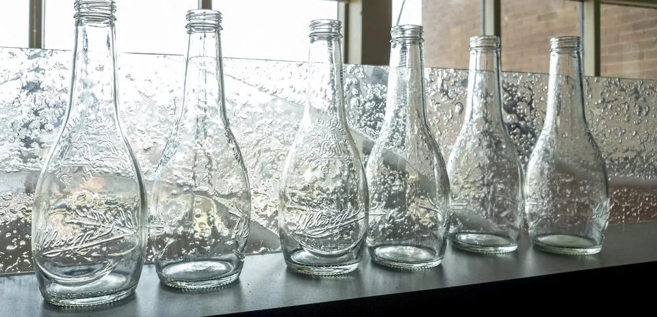Six empty antique transparent glass bottles Stock Photos