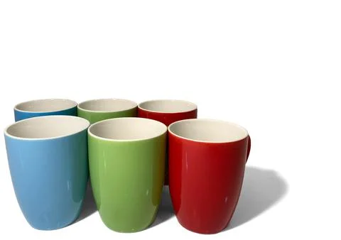 Six empty cups stand on a white background in two rows. Stock Photos