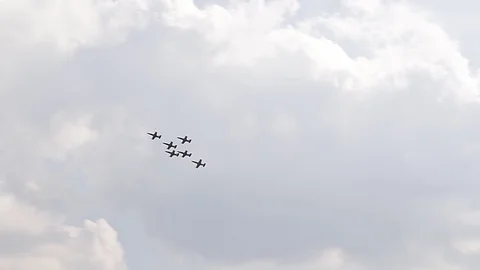 Six fighter jets in the blue sky. A general plan. Aerobatic figures. Airshow. 10 Stock Footage 124143374