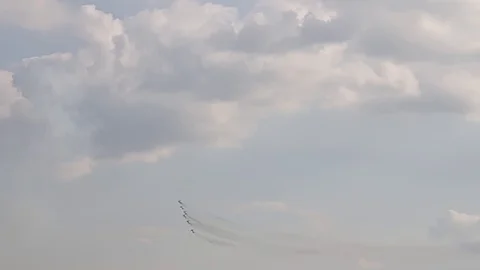 Six fighter jets in the blue sky. A general plan. Aerobatic figures. Airshow. 15 Stock Footage 124147099