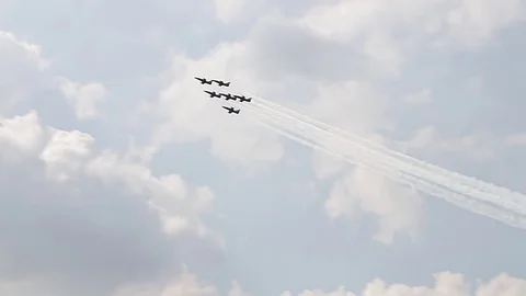 Six fighter jets in the blue sky. A general plan. Aerobatic figures. Airshow. 6 Stock Footage 124147141