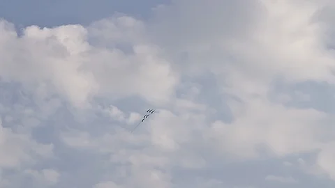 Six fighter jets in the blue sky. A general plan. Aerobatic figures. Airshow. 13 Stock Footage 124147643