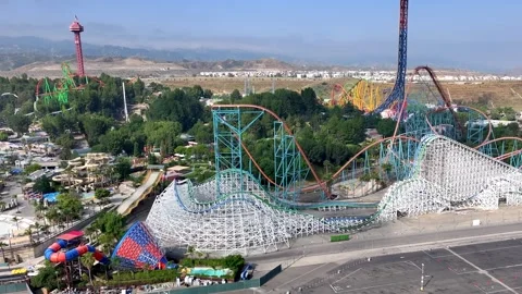 Six Flags Magic Mountain Amusement Park without people - sliding aerial Stock Footage 252738470