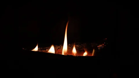 Six Flames in a Row on a Log in the Hearth Stock Footage 129261557