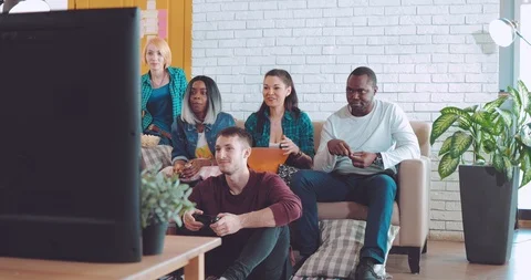 Six funny friends play console games and have fun at home Stock Footage 88652843