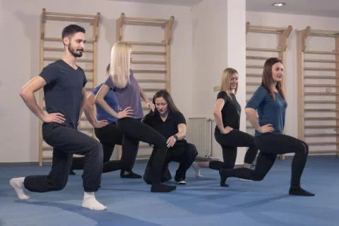Six people group, trainer instructor fitness lunge Stock Photos
