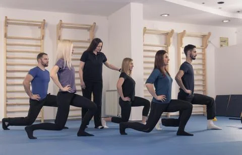 Six people group, trainer instructor fitness lunge Stock Photos