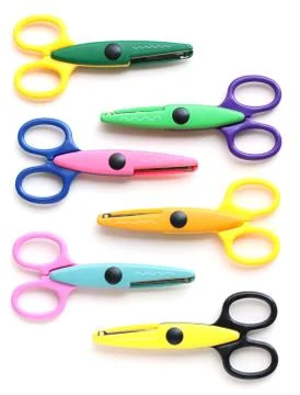 Six pinking shears for children isolated on white Stock Photos