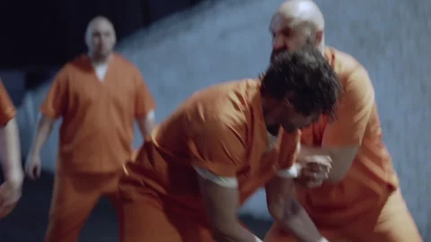 Six Prison Yard Inmates playing basketball violently Stock Footage 283083258