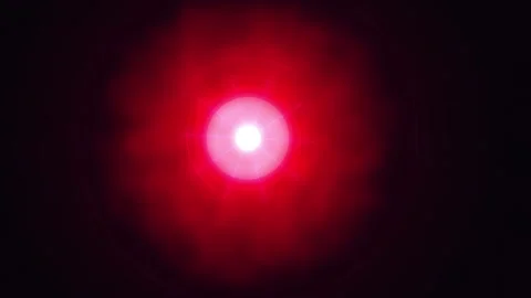 Six red LED lights glowing with radial light flares against a dark background Stock Footage 340941926