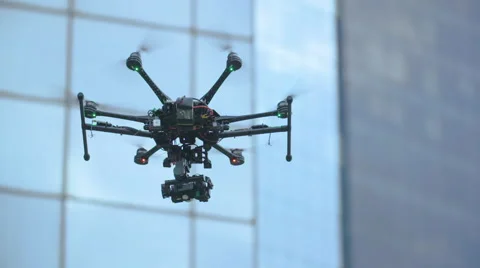 Six Rotor Drone with Camera on Gimbal flying in the Sky. Shot in Slow motion. Stock Footage 64990815