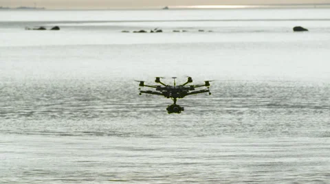 Six Rotor Drone with Camera on Gimbal flying in the Sky. Shot in Slow motion. Stock Footage 64991011