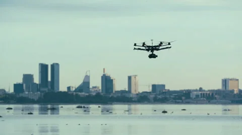 Six Rotor Drone with Camera on Gimbal flying in the Sky. Shot in Slow motion. Stock Footage 64991021