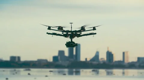 Six Rotor Drone with Camera on Gimbal flying in the Sky. Shot in Slow motion. Vídeo Stock 64991071