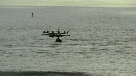 Six Rotor Drone with Camera on Gimbal flying in the Sky. Shot in Slow motion. Stock Footage 64991129