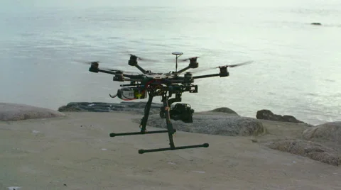 Six Rotor Drone with Camera on Gimbal flying in the Sky. Shot in Slow motion. Stock Footage 64991140