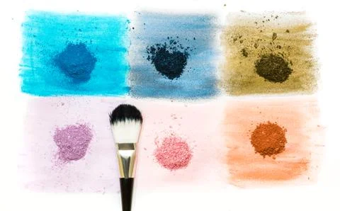 Six samples of bright dry pigment with a brush Stock Photos