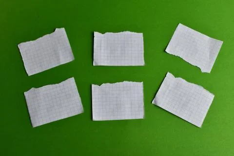Six sheets for writing on a green background Stock Photos