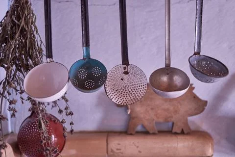 Six spoons hanging in the kitchen Stock Photos
