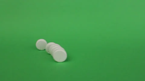 Six tablets rolling out in the frame and then three rolling back 動画素材 25877426