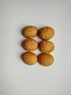 Six walnut shells on a white background Stock Photos