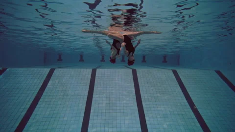 Six women in the pool lined up and performing Stock Footage 283101193