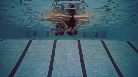 Six women in the pool lined up and performing Stock Footage 283101460