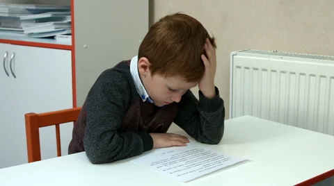 Six-year-old boy in class Stock Footage 65564308