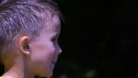 A six-year-old child has wet his head. Video stock 109570474