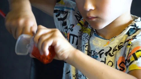 A six-year-old child sharpens colored pencils. Stock Footage 109558982