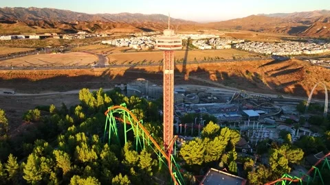 SixAerial Six Flags Magic Mountain amusement park entrance, rollercoasters, ride Stock Footage 282309807