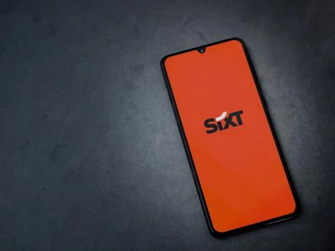 SIXT rent app launch screen on smartphone on dark marble stone background Foto stock