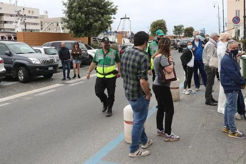 Sixty security volunteers regulate the influx to the free beaches, Rome, Italy - Stock Photos