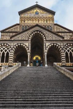 Sixty-two steps, wide and steep, lead up to the doors of Amalfi Cathedral Stock Photos