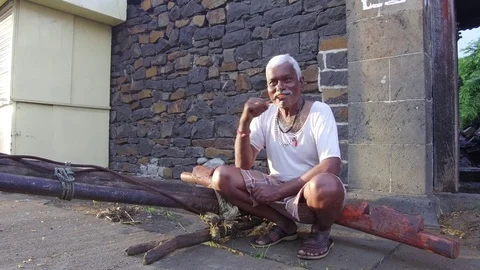 Sixty year Indian man brushing his teeth Stock Footage 77648801