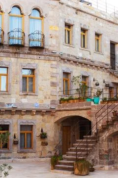 Sizable stone building structure featuring stairs that lead up to it Stock Photos