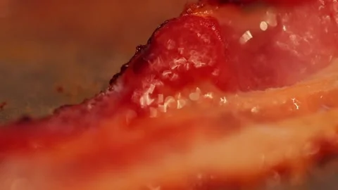 Sizzling Bacon in Close up and slow motion Stock Footage 149118642