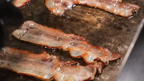 Sizzling Bacon Cooking in Hot Pan, Close-Up Macro Shot Stock Footage 331633139
