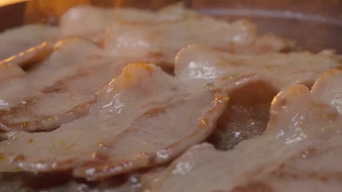 The Sizzling Bacon is Currently Being Cooked to Absolute Perfection in a Hot Pan Stock Footage 305271744