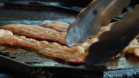 Sizzling bacon Stock Footage