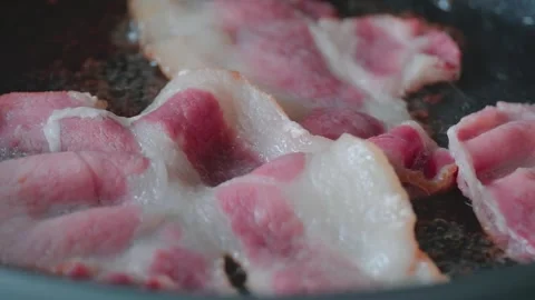 Sizzling bacon in frying pan. Stock Footage 282512986