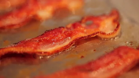 Sizzling bacon in slow motion Stock Footage 149118648