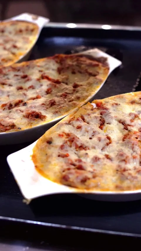 Sizzling Beef Lasagna in Gratin Dishes Stock Footage 336942540