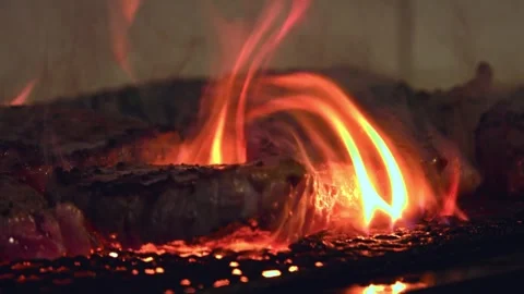 Sizzling Beef Perfection: Close-Up of a Juicy Steak Grilling to Flavorful Stock Footage 288692017