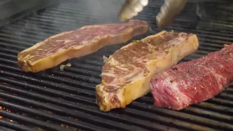 Sizzling Beef Steaks Grilling on BBQ 스톡 동영상 332817769
