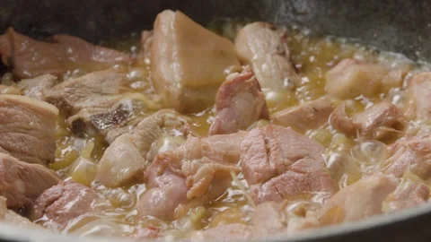 Sizzling Deep fried port in a big pot Stock Footage 310017992
