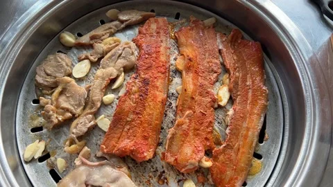 Sizzling Korean BBQ on Grill Stock Footage 244908143